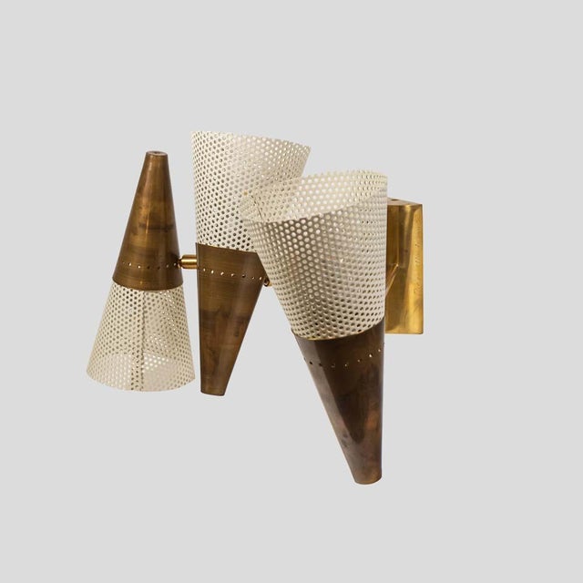 Joie de vivre 3 , perforated metal cream color lacquered shades on brass metal. The 3 wall light shades can be moved...