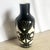 This vintage 1989 sgraffito pottery vase by the Curras Brothers features a striking black ground carved with crisp white,...