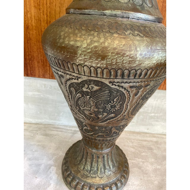 Vintage Sanskrit floor vase. Hammered metal that I believe to be zinc with a mixed color finish. Has not been tested to...