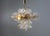 This elegant mid-century chandelier originates from Europe and dates to the 1960s. It features a refined brass...