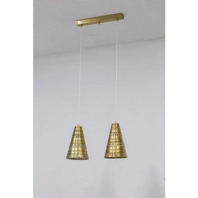 Ceiling Lamp Model 70 Designed by Hans Bergström. Produced in Sweden by Ateljé Lyktan During the 1950s. Two perforated...