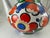 Striking mid-century oversized hand painted porcelain teapot in a unique shape decorated with vines and fruit crafted in...