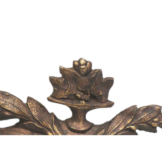 Ornate bronze urn with leaves applique. One available. The manufacturer and exact date of creation are unknown. This item...