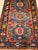 This exquisite late 19th century Caucasian Kazak rug features three striking medallions woven in vibrant abrash shades of...