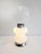 This striking vintage floor or table lamp, with playful proportions and a futuristic silhouette, is a true example of...
