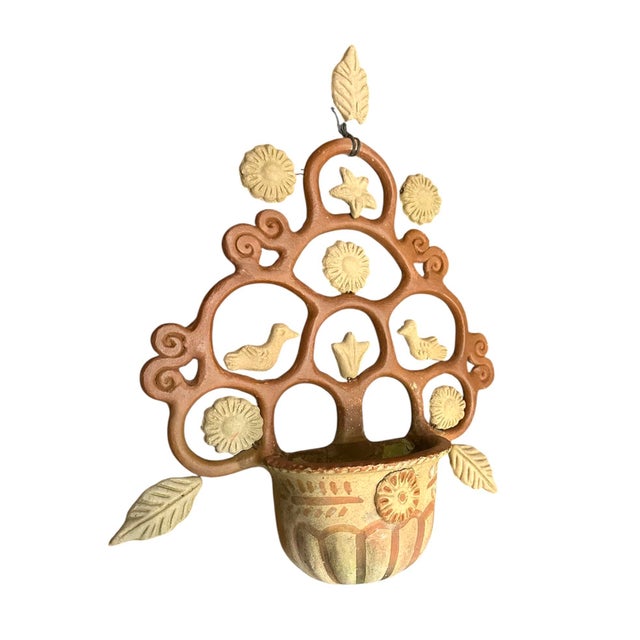 A whimsical, folk art wall pocket/planter. Features a handmade, cast clay wall pocket adorned with hand molded leaves,...