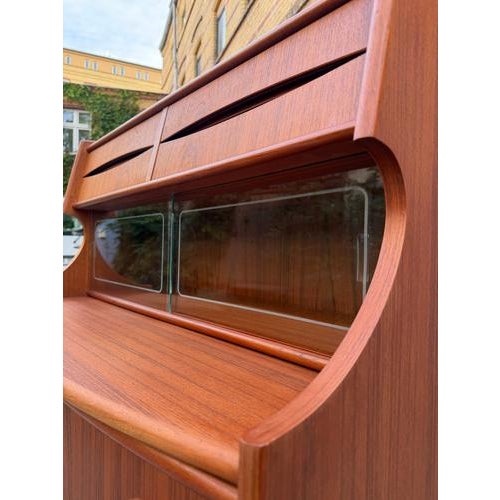 This elegant teak secretary desk, designed by Gunnar Falsig for Holstebro Møbelfabrik, is a true masterpiece of...