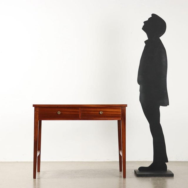 Writing desk with drawers under the top, solid beech wood stained and mahogany veneer, top covered in formica. Completely...