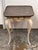 Design Plus Gallery presents a Swedish Faux Porphyry Top Side Table + Drawer. The table has a mottled tray style top with...