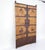 This pair of 19th century Chinese door panels showcase a masterful blend of rustic wood and hand-forged ironwork. With...