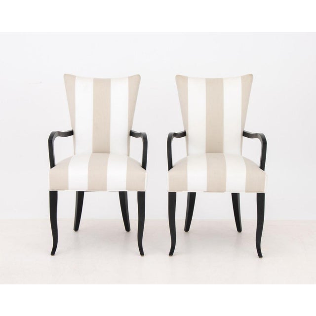 Pair of Modern Black Lacquered Upholstered Arm Chairs. 38" H x 22" W x 22" D; seat: 19" H. Provenance: From a 45 Sutton...