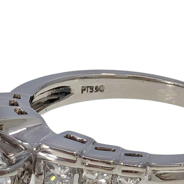 Estate Princess Cut Accented Platinum Engagement Ring CZ Center. This estate platinum engagement ring features a stair-...