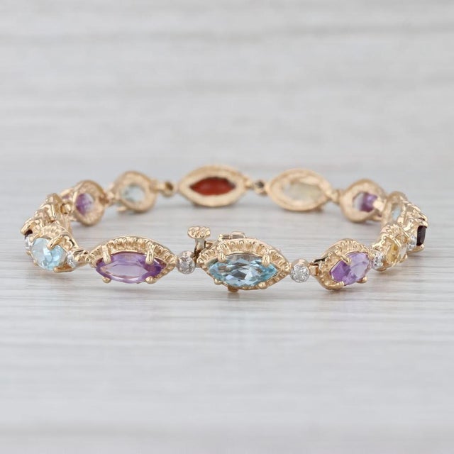 Gemstone Information: - Natural Diamonds - Total Carats - 0.07ctw Cut - Single Color - G - I Clarity - I3 - Natural Topaz...