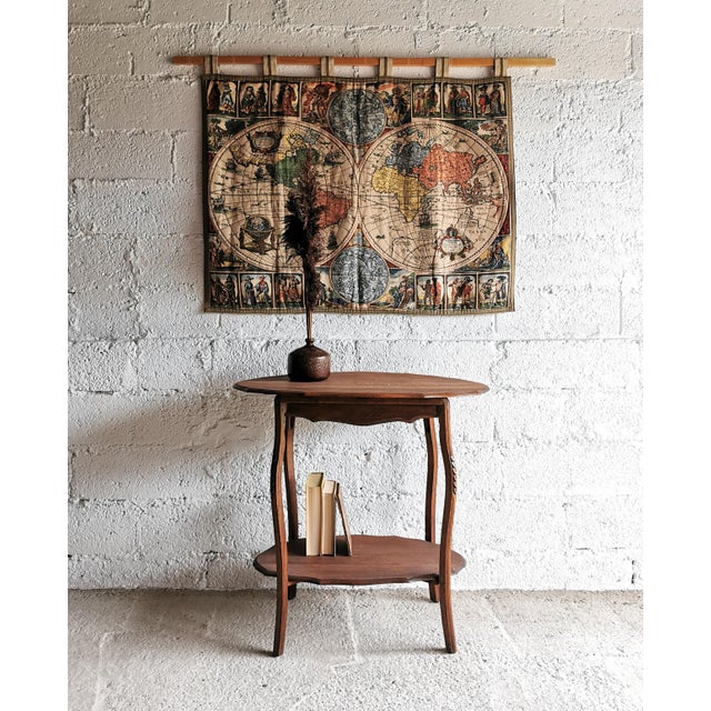 This tapestry, featuring a historical world map in the style of Gerardus Mercator (16th century), was produced in the...