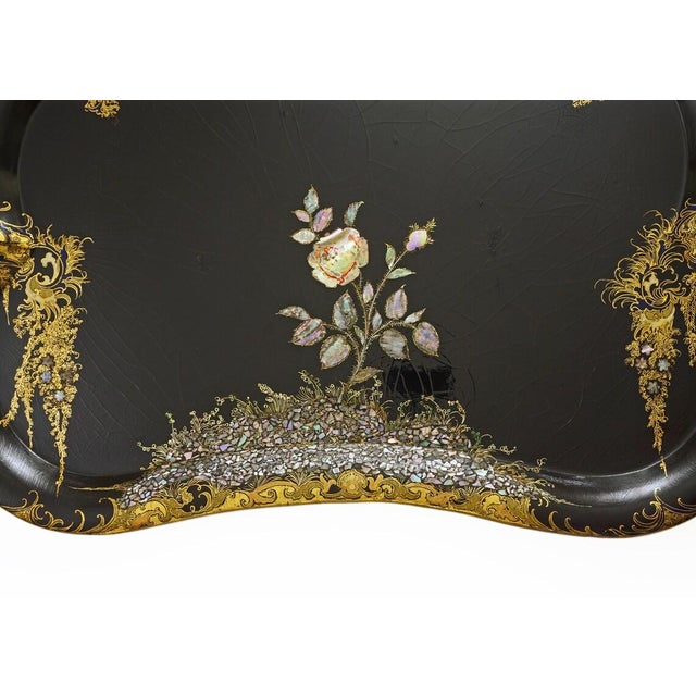 This exceptional 19th-century English papier-mâché parlor maid tray features raised edges, luminous crushed-shell mother-...