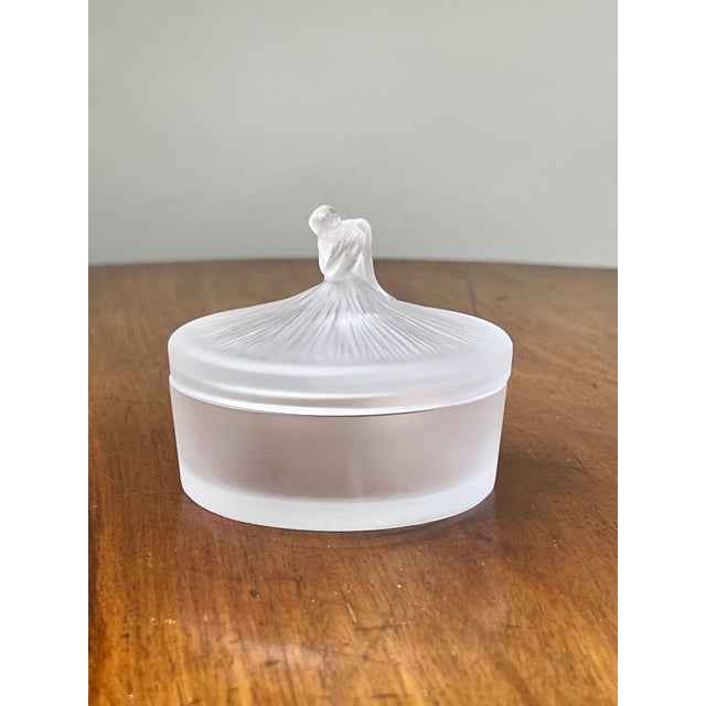 Elegant and unmistakably French, this vintage Lalique covered powder box features one of the firm’s most graceful figural...