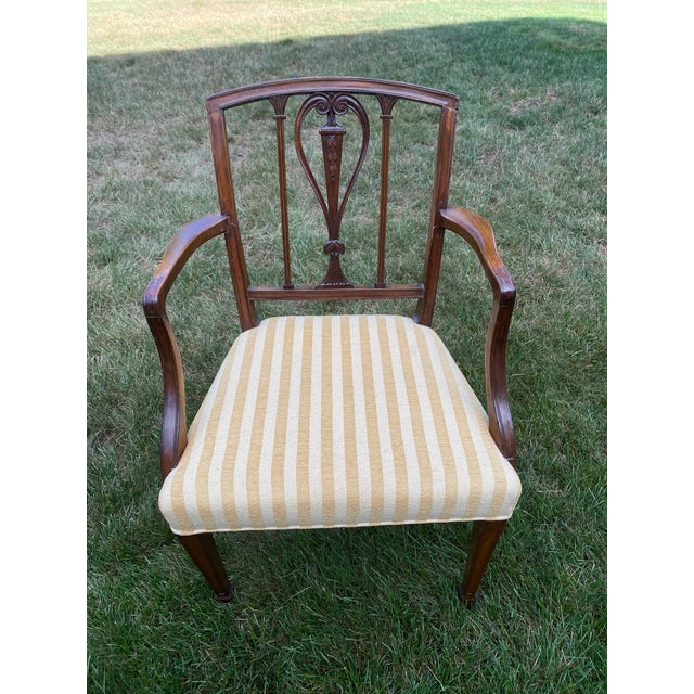 Set of six sides and two arm period transition Sheraton Hepplewhite dining chairs, circa 1780-90. Finely carved splat with...