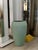 An extremely rare light green glazed ceramic vase, moulded by slip casting. The piece has a slender, ovoid shape that...
