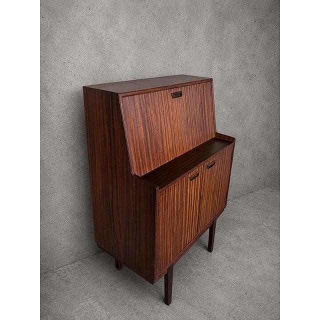 Details Mid century bureau cabinet Walnut and teak construction Drop-front writing desk Fitted interior with pigeonhole...