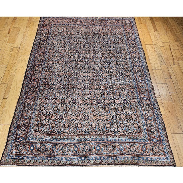 An antique Persian Tabriz rug of exceptional beauty, this handwoven masterpiece from the first quarter of the 20th century...