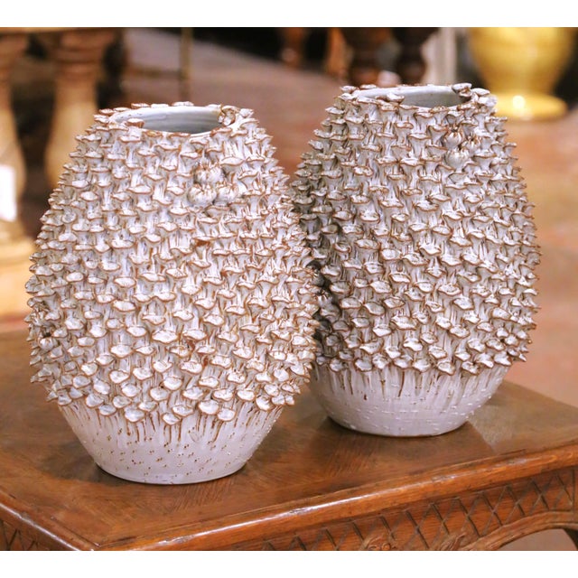 This sculptural pair of contemporary French ceramic vases was crafted circa 2010 and reflects the refined organic...