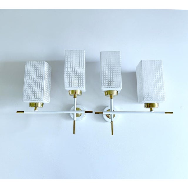 Pair of Vintage mid century french sconces with square opaline glass shades with a contrasting checkered serigraphed...