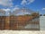 Monumental Antique Double-Leaf Gate in Solid Wrought Iron with Scrolls and Swirls (4 Meters Wide) A refined and majestic...