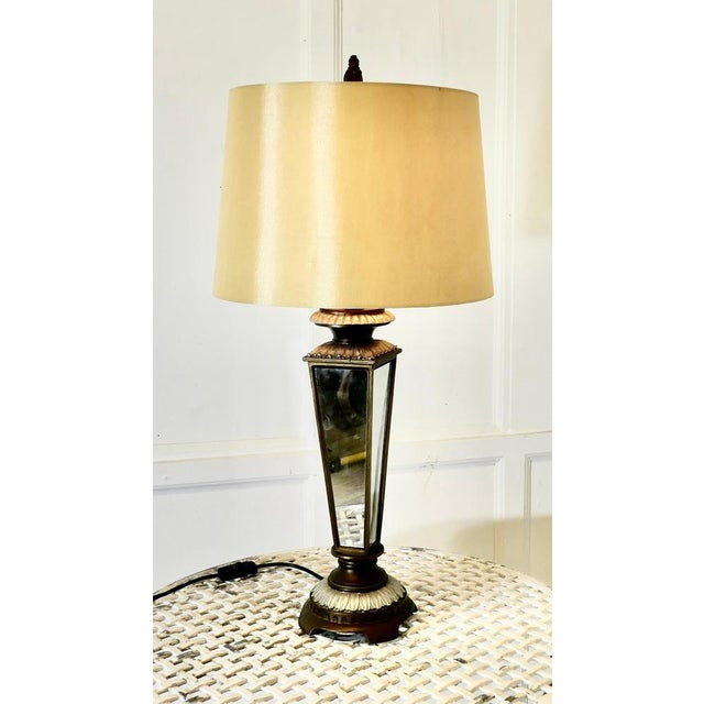 An Art Deco Style Mirror Table Lamp The lamp stands on a circular bronzed and silvered foot, it has a 4 sided mirrored...