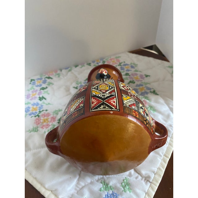 This type of vessel was historically used by the Incas for storing and transporting liquids. This is a beautiful hand-...