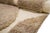 A single gesture, drawn in light: bold lines cutting across a field of warm earth. Ivory lines sweep across a heathered...