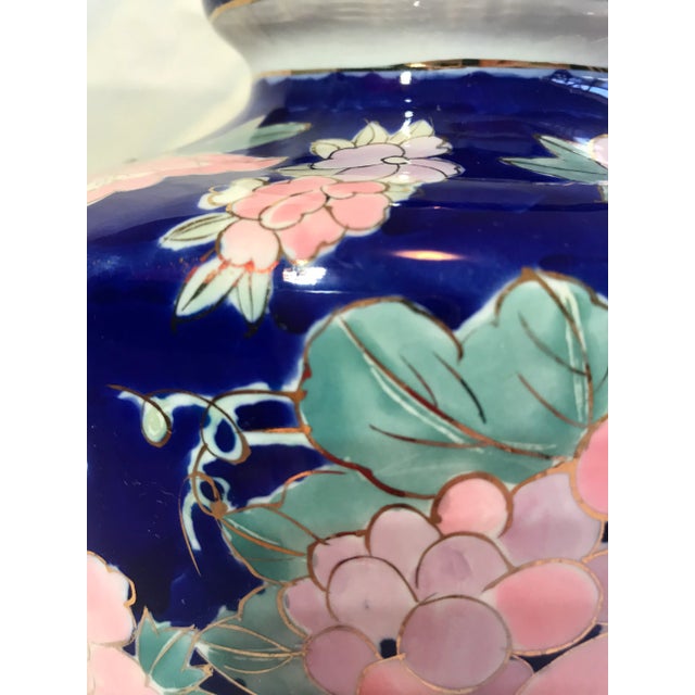 Fabulous vintage Chinoiserie floral vase. This large vase is blue, pink, and green with the flowers being outlined in...