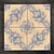 6" x 6" decorative ceramic tile with a hand painted blue floral design on an antique white matte background. Tiles are...