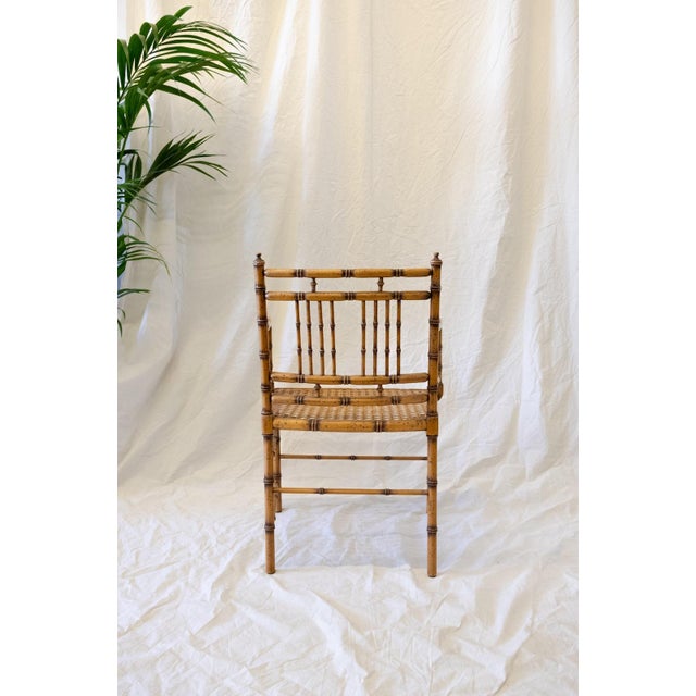 Faux Bamboo Armchair with Vienna Straw Seat – 1970s Turned wood structure with a faux bamboo finish and a woven Vienna...