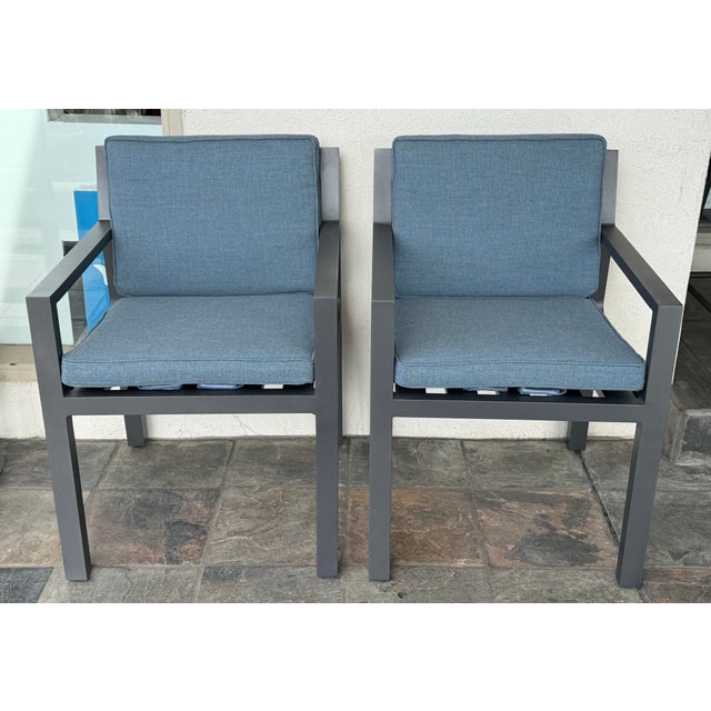 Design Plus Gallery presents a Pair of Rhodes Aluminum Outdoor Dining Armchairs from Restoration Hardware. These armchairs...