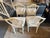 This is a set of four antique Mahogany Hepplewhite style Shield back chairs. They are hand painted French linen white....