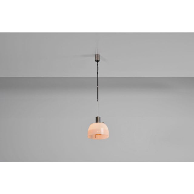 This amazing, in very good original condition, model 4437 pendant lamp designed by Giuseppe Ostuni and Renato Forti in...