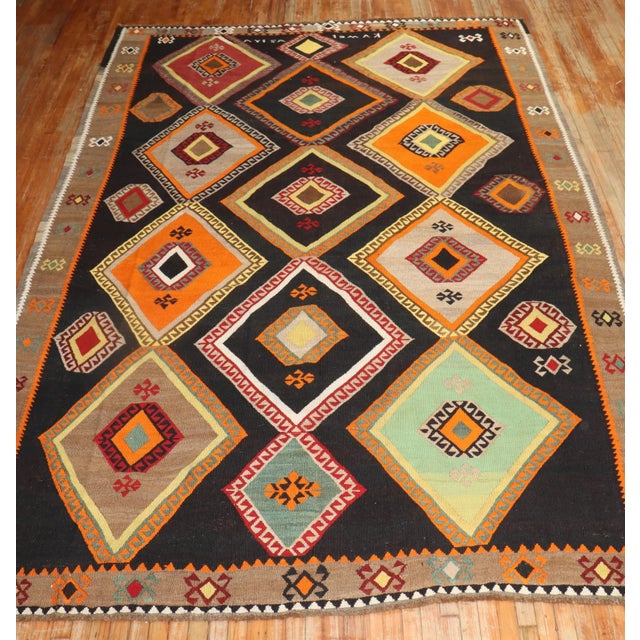 one of a kind mid 20th Century hand-knotted room size Turkish Kilim Kilims, primarily refer to a type of flat woven rug...