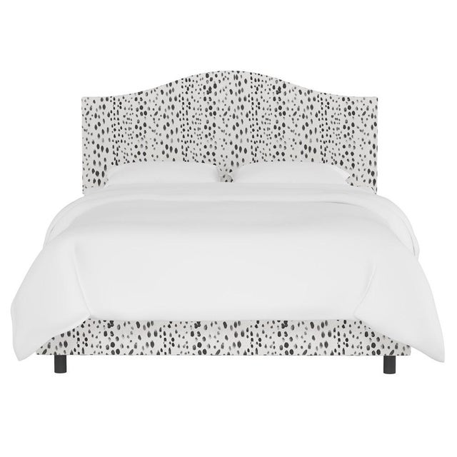 This fully upholstered bed has a unique headboard shape, allowing you to chart a course for a bedroom retreat that is at...