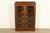 A beautiful antique Mission or Arts & Crafts period glass front bookcase or display cabinet In the manner of Charles P....