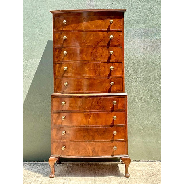 Exuding classic 18th-century English elegance, this vintage tallboy dresser showcases the timeless grace of traditional...
