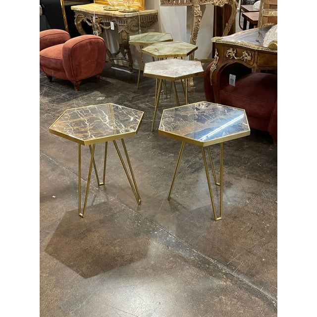 Modern Italian hex form table in polished brass and nero potoro marble. Circa 2000. Perfect for today's transitional designs!