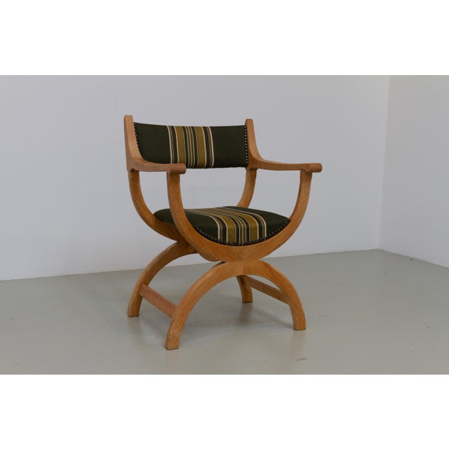 Danish Kurul Armchair in Oak and Striped Green Wool by Henning Kjaernulf for EG Kvalitetsmøbel, Denmark, 1960s. This...