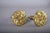 A beautifully cast pair of gilt bronze curtain tiebacks, each featuring a richly modelled floral rosette with radiating...