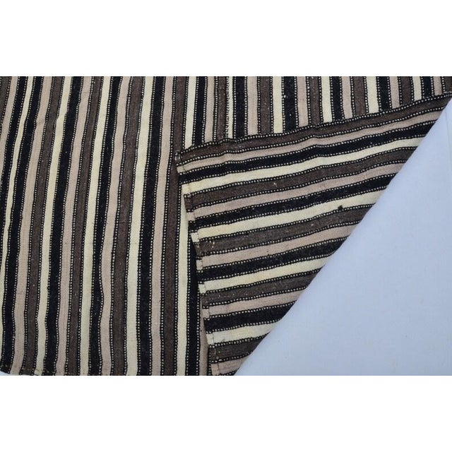 Black Vintage Mid-Century Turkish Striped Kilim Rug With Muted Earth Tones For Sale - Image 8 of 11
