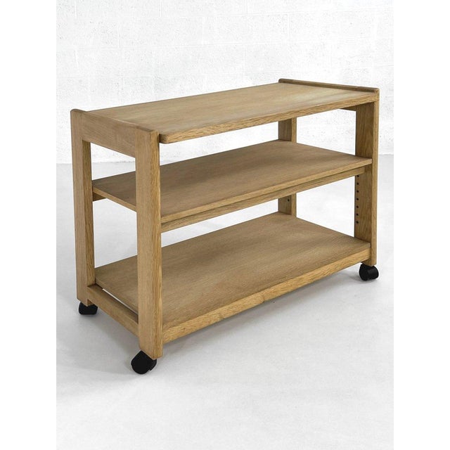 A French-designed bar cart from the 1960s by Guillerme et Chambron for Votre Maison, featuring a minimalist oak frame,...