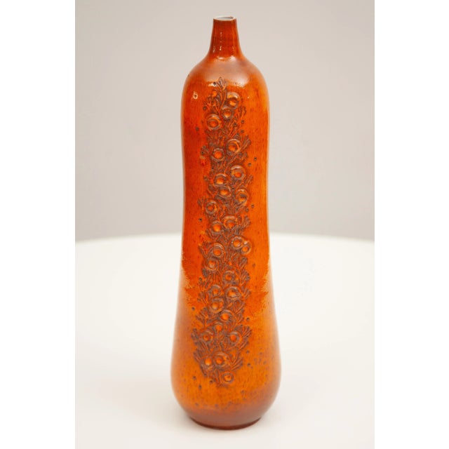 Beautiful large bottle-vase handcrafted earthenware covered with a combined selenium glaze with applied decoration by the...