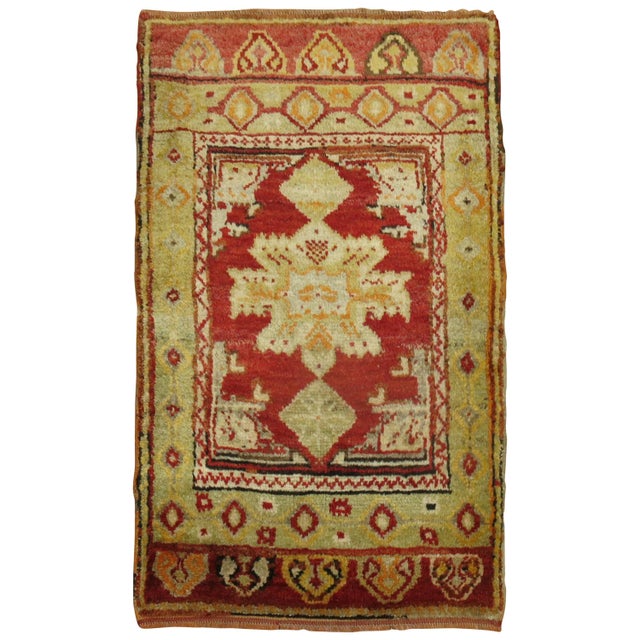 An early 20th century full even pile condition cherry red color Turkish rug. 1'11'' x 3'