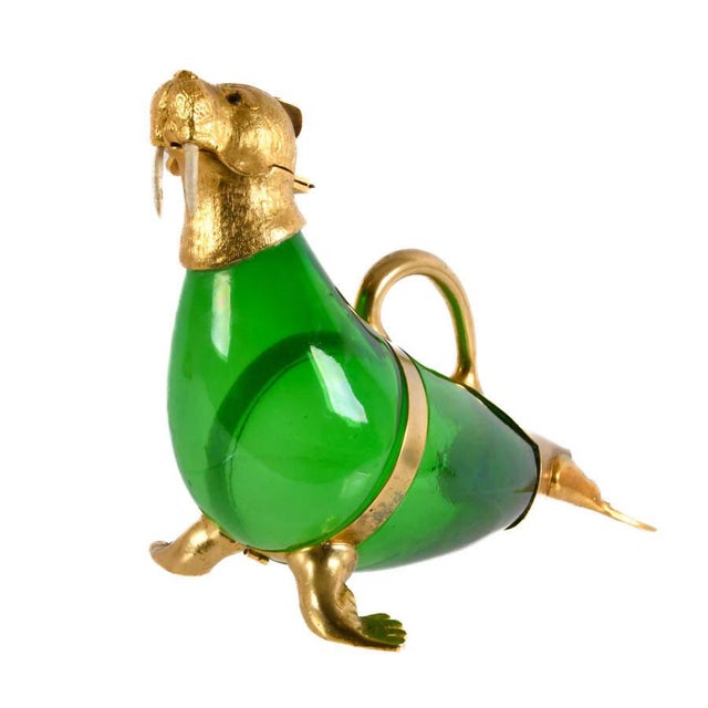 Whimsical, sculptural, and highly decorative, this Green Glass and Gilt Metal Walrus Claret Wine Decanter is a captivating...
