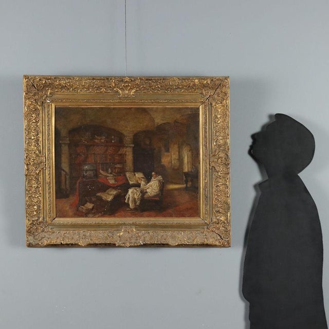 Oil on canvas. Signed lower right. Inside a study, with thick stone walls and a vaulted ceiling, simple furniture but a...