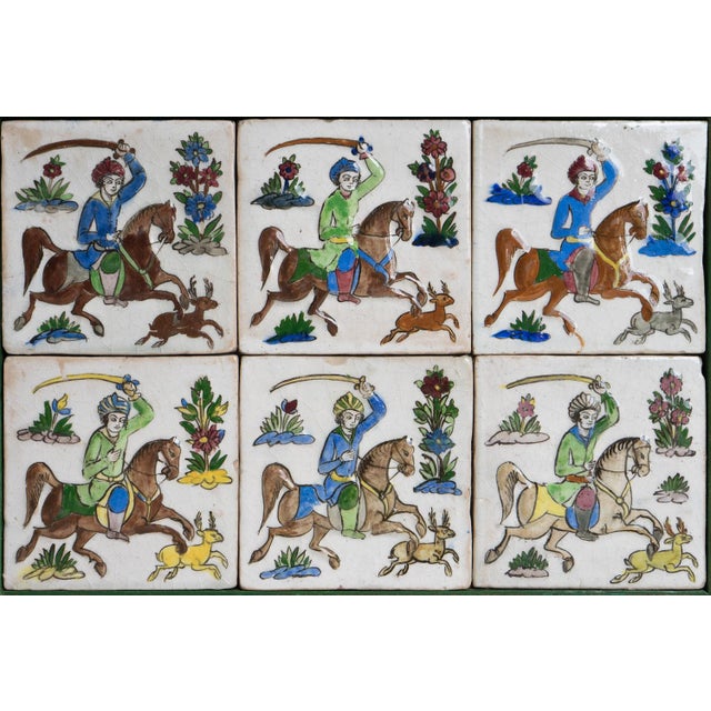 ANTIQUE FRAMED TILES A set of six hand painted glazed earthenware tiles. each one is formed in a slightly three-...